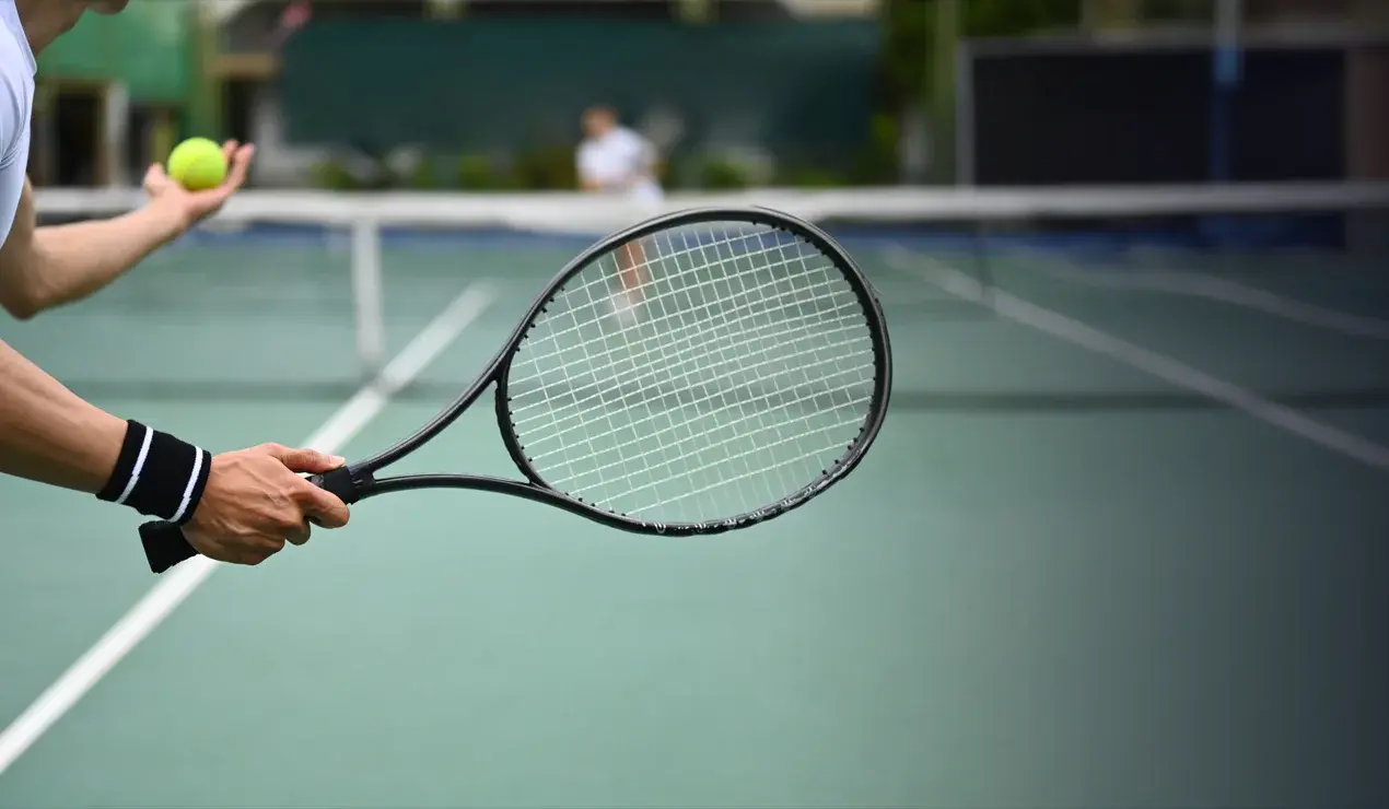 Tennis player about to serve